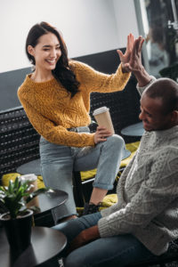 Biracial couple connecting over coffee