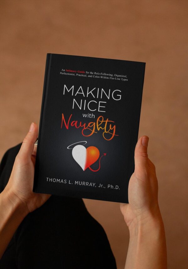 Man holding book, “Making Nice with Naughty: An intimacy guide for the rule-following, organized, perfectionist, practical, and color-within-the-lines types.”